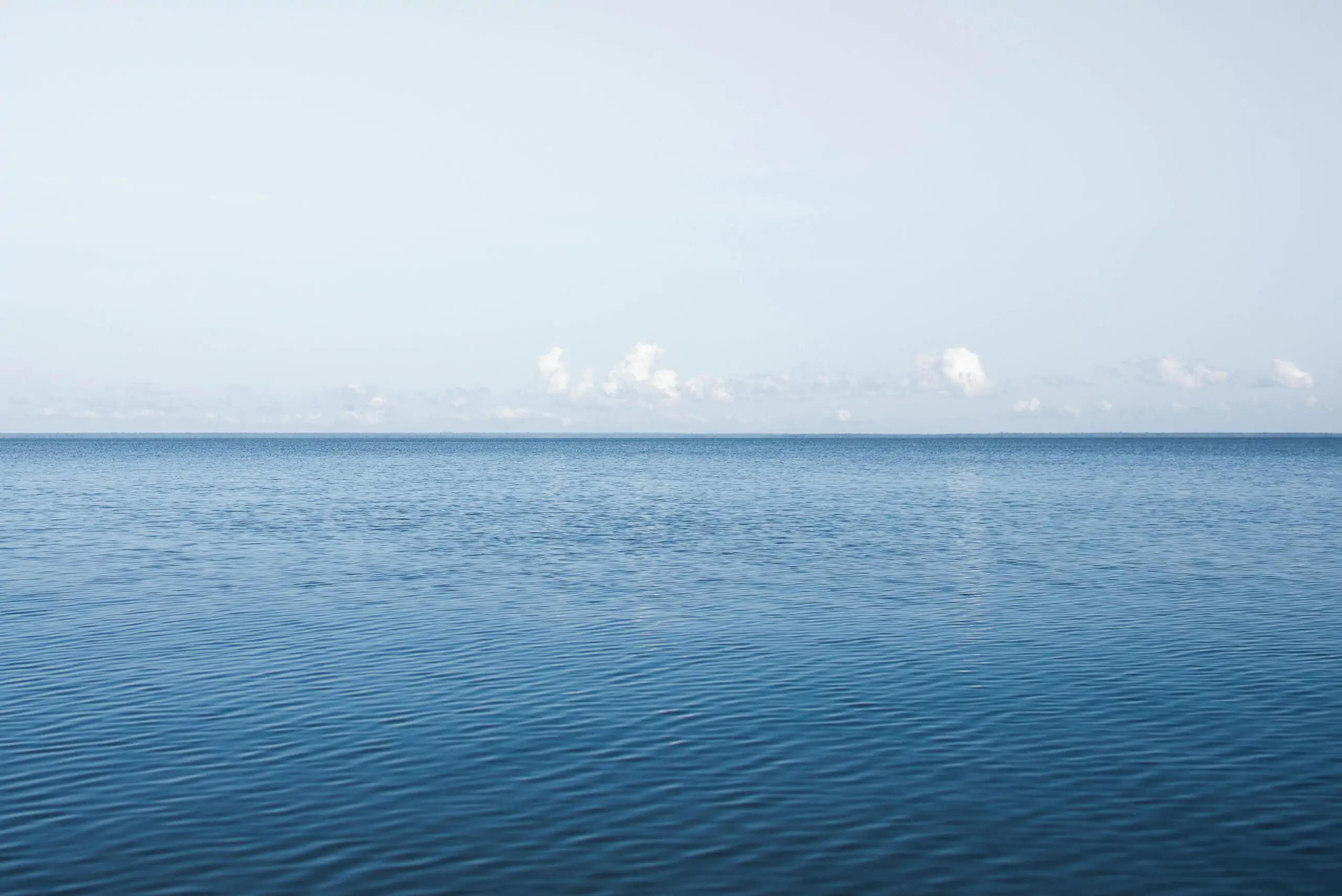 blue sea under blue sky during daytime